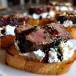 Close-up of a perfectly cooked steak crostini topped with creamy cheese and drizzled with balsamic glaze.