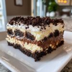 A layered slice of a rich, no-bake chocolate and cream dessert, a perfect quick & easy decadent dessert.